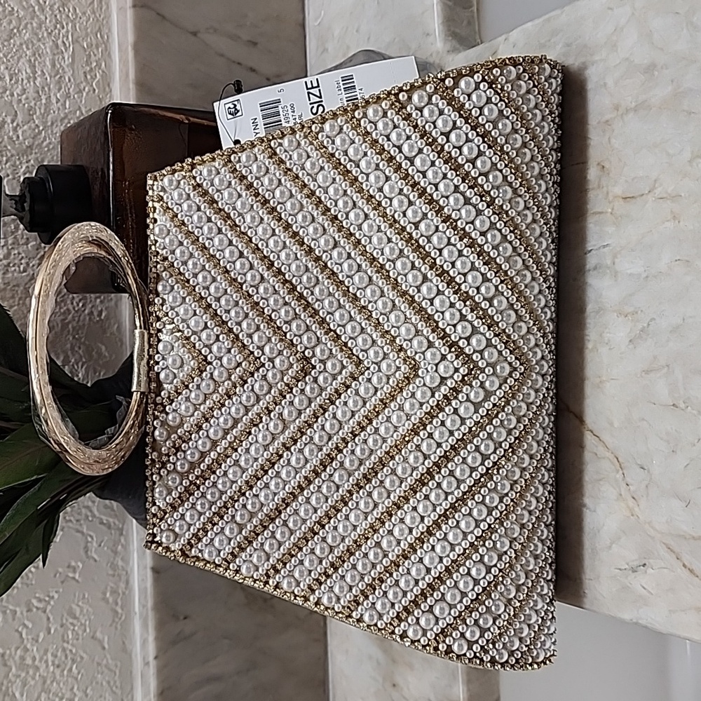 Brynn Gorgeous hand clutch. Gold and pearl